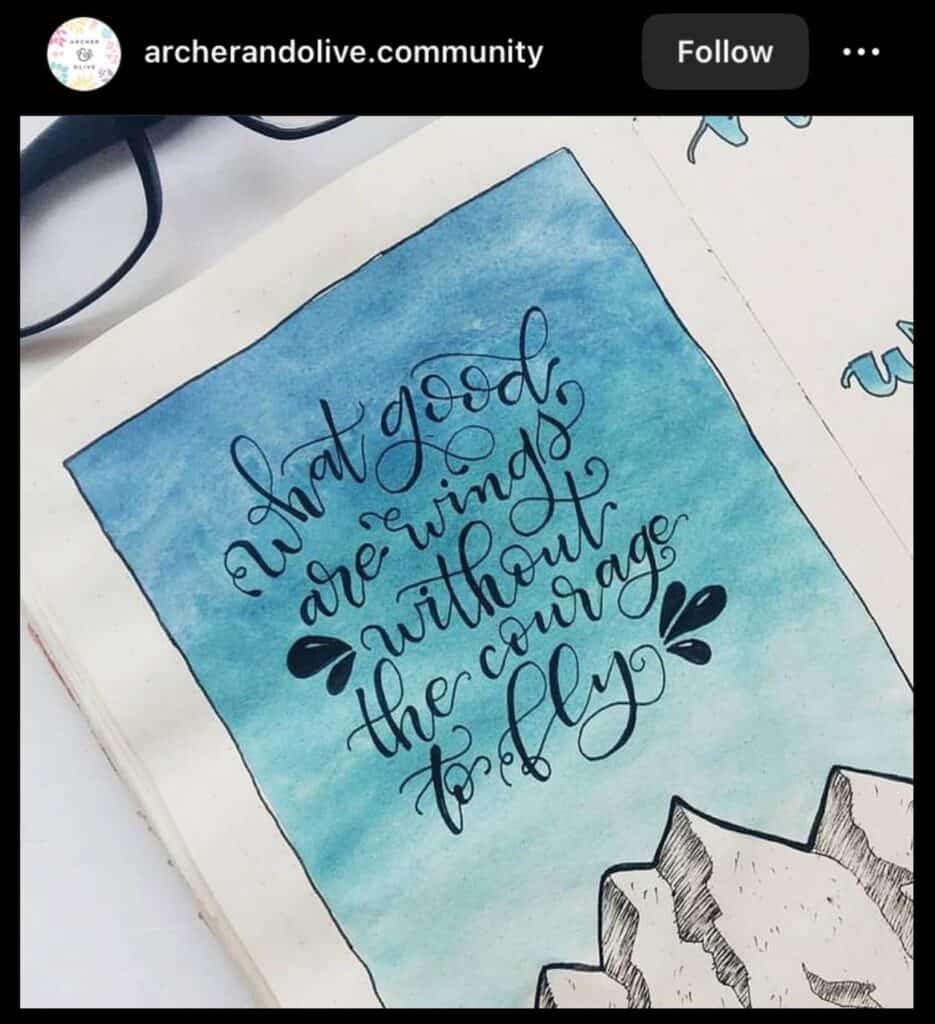 inspiring blue bullet journal spread with a quotation